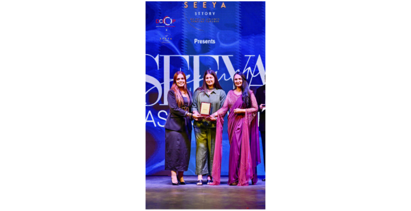 Neha Bhatia receiving award at Seeya Fashion Week Delhi 2024